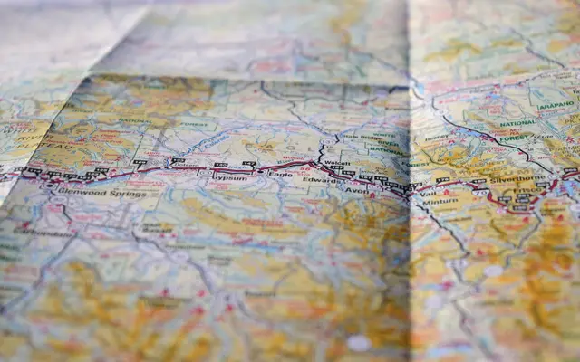 Close-up of a folded road map with a highway route